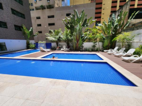 Lindo Flat Capitania Varam , WI FI , 2 aparelhos de ar condicionado , serviço de praia , enorme sacada com vista ao mar e telas de proteção para as crianças , 3 piscinas